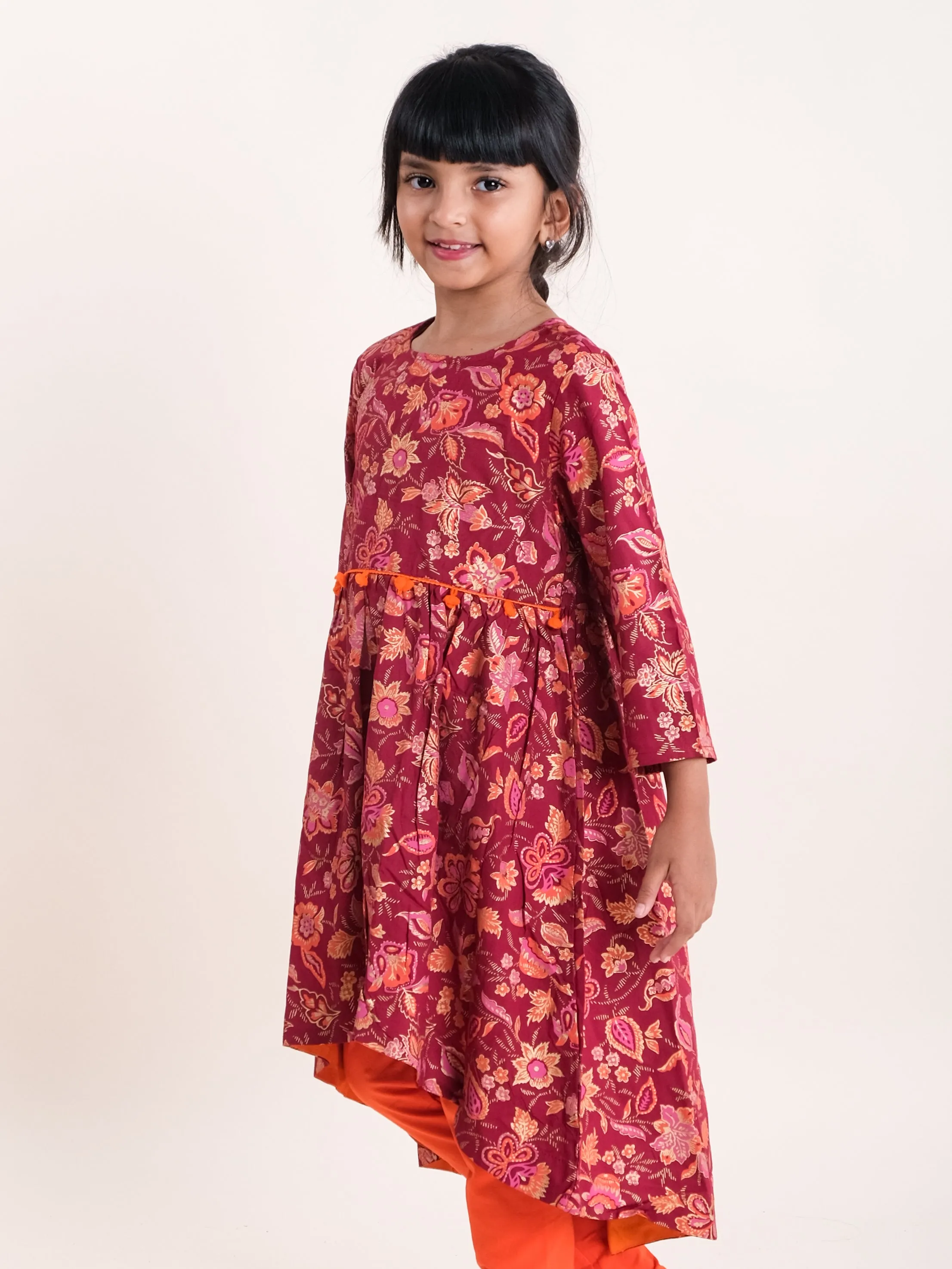 Girls Asymmetric Hem 3/4th Sleeve Kurta With Motif Print Design